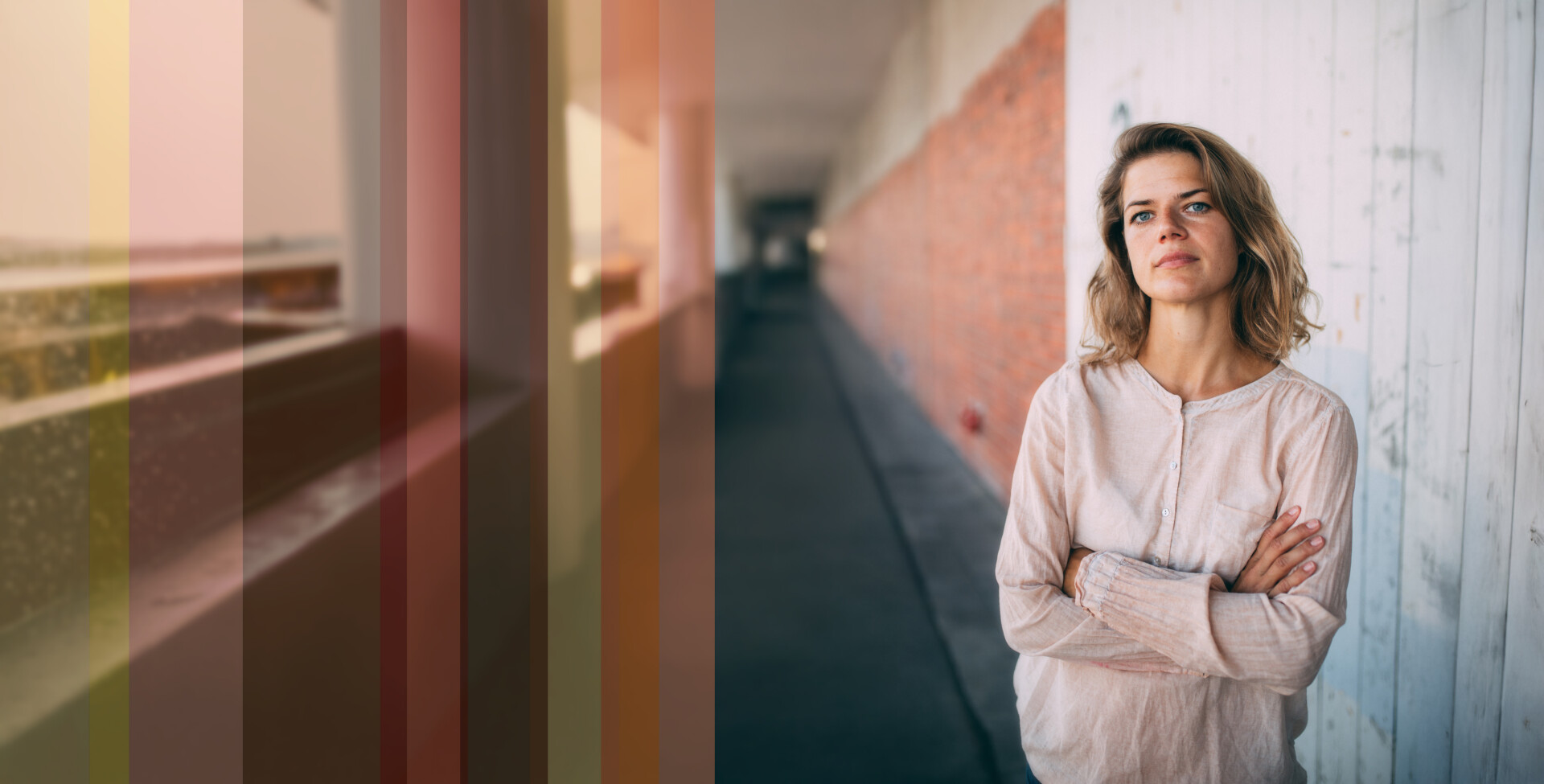Portrait woman standing against wall